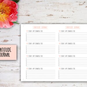 May include: A printable gratitude journal with a pink background and the text "Gratitude Journal" at the top of each page. The journal has space for writing down five things you are grateful for each day.