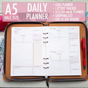 May include: A brown leather A5 daily planner with a zipper closure. The planner has a white interior with sections for "Today", "To Connect", "Health/Exercise", "Meal Plan", "Schedule", "Today's Wants", and "Daily Habits".