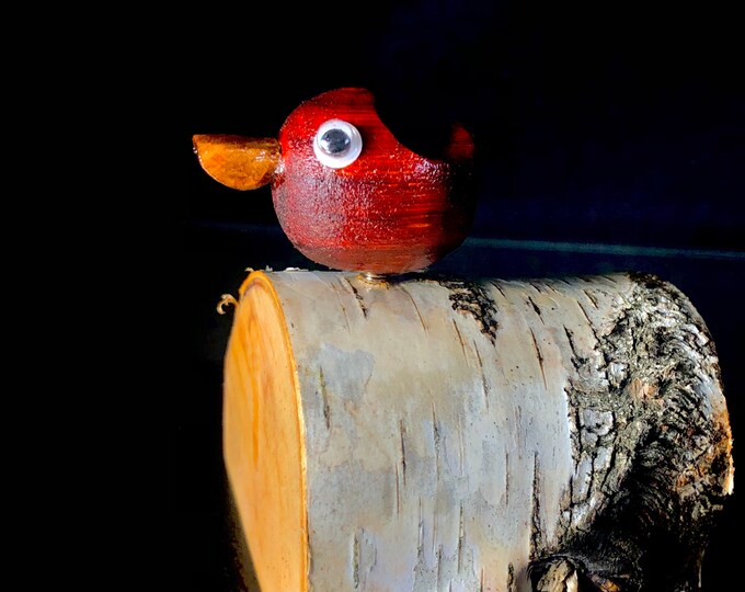 Wood work art creation. Wooden sculpture of Mister Cardi. Decorative bird in wood, made of red padauk and cotton maple