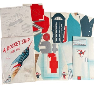 Kit de cohete de papel con tarjeta de juguete Hallmark vintage de mediados de siglo Estado RARO: Sin perforar Sin usar, pero el sobre se ha abierto y hay