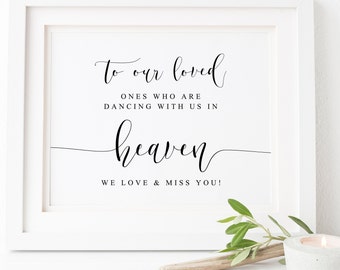 May include: A white framed print with black text that reads "To our loved ones who are dancing with us in heaven. We love & miss you!"