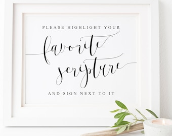 May include: White framed sign with black text that reads "Please highlight your favorite scripture and sign next to it".
