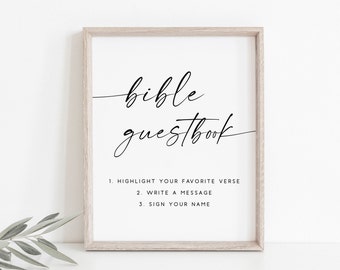 May include: A framed sign with the text "bible guestbook" in black cursive script. Instructions below read: "1. Highlight your favorite verse 2. Write a message 3. Sign your name"