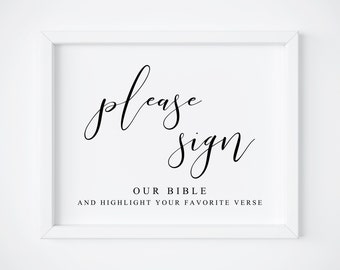 May include: White framed sign with black calligraphy that says "please sign our bible and highlight your favorite verse".
