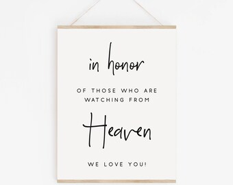 May include: A white sign with black text that reads "in honor of those who are watching from Heaven. We love you!"