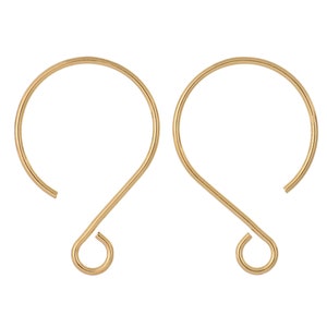 May include: A pair of gold-toned earring hooks with a simple, curved design.