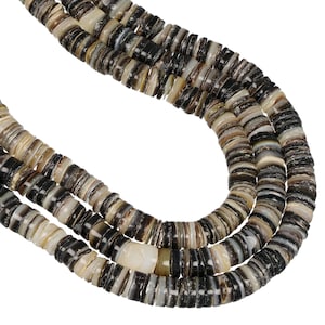 May include: A multi-strand necklace composed of small, flat, circular beads in varying shades of black, gray, brown, and cream. The beads have a smooth, polished finish and are strung together to create a layered, textured appearance throughout.