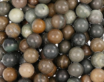 May include: A close-up of a collection of round, smooth, brown, grey, and green gemstone beads. The beads have a natural, marbled pattern.
