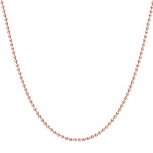 May include: A delicate rose gold ball chain necklace. The necklace is composed of small, evenly spaced, spherical beads. The chain is displayed against a white background, highlighting its color and design. This necklace is a simple yet elegant piece of jewelry.