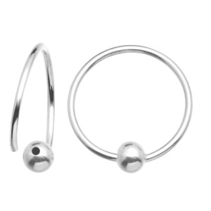 May include: A pair of silver hoop earrings with a small ball at the end of each hoop.