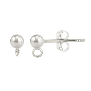 May include: A pair of silver-colored stud earrings. Each earring features a small, round ball with a loop for attaching charms or other decorative elements. One earring has a post and butterfly backing.