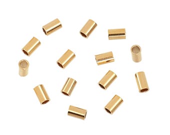 May include: A scattering of 14 gold-colored metal tube crimp beads, ideal for jewelry making.