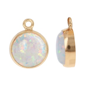 May include: Gold-tone pendant with a round, white opal gemstone. The pendant has a loop at the top for attaching to a chain or cord.
