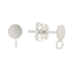 May include: A pair of silver earring blanks with a round disc and a jump ring. The earring backs are also silver.