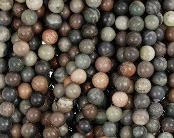 May include: A close-up image of a collection of round, smooth, green, brown, and grey gemstone beads. The beads are made of natural stone and have a variety of patterns and textures.