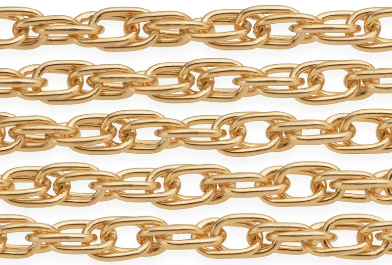 May include: Five rows of gold chain links, each link is oval shaped and interlocked with another oval link. The chain is a continuous loop.
