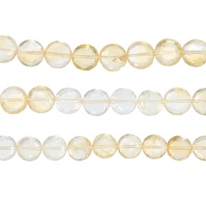 May include: Three strands of faceted citrine gemstone beads. The beads are round, with a mix of clear and pale yellow hues. The beads are strung together, creating a natural and elegant look. Ideal for jewelry making.