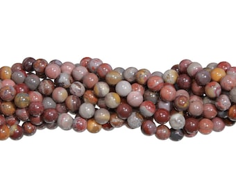 Peut inclure: Un chapelet de perles rondes en pierres précieuses aux tons rouges, bruns, gris et crème. Les perles polies ont un fini brillant. Idéales pour la création de bijoux, les perles mesurent environ 8 mm de diamètre.