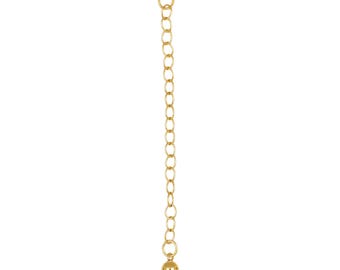 May include: A gold-colored chain extender with a small ball at the end. The chain is made of small, oval links and has a ring at the top for attachment. The words "MADE IN USA" are printed below the chain, along with a small American flag.