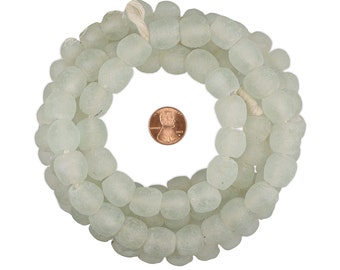 May include: A strand of light green glass beads, each bead is round and slightly irregular in shape. The beads are approximately the size of a US penny.