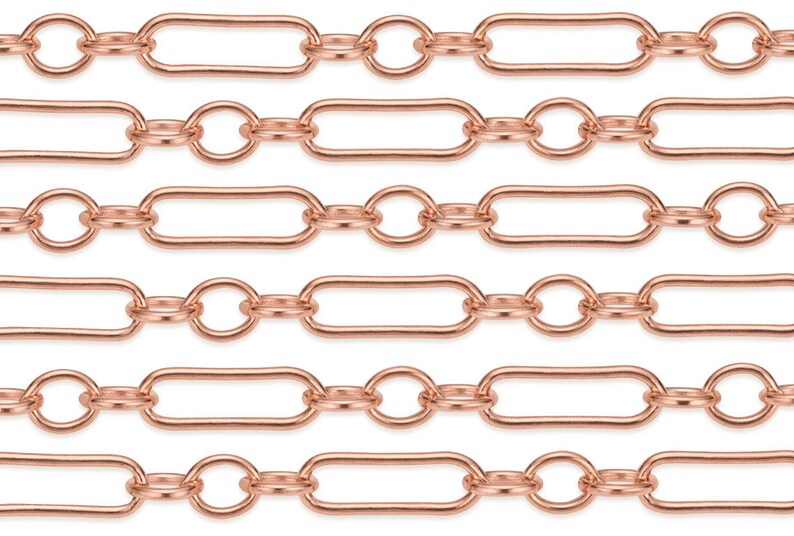May include: A close-up of a rose gold chain with oval and round links. The chain is made of metal and has a shiny finish.