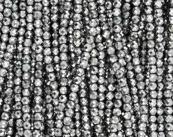May include: A strand of silver faceted beads. The beads are round and have a shiny, metallic finish.