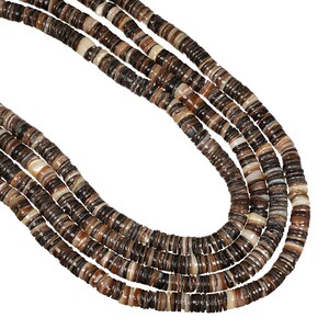May include: A multi-strand necklace composed of numerous small, flat, circular beads in varying shades of brown, tan, cream, and black. The beads are arranged in a stacked, layered formation, creating a textured, cylindrical appearance throughout.