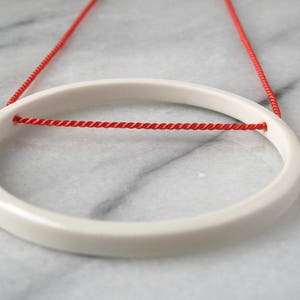 white minimalist circle pendant on bright orange silk / 12th, 18th, 20th anniversary gift / ceramic handmade jewelry / gift for her image 3