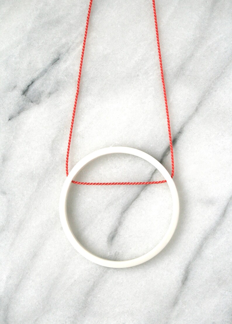 white minimalist circle pendant on bright orange silk / 12th, 18th, 20th anniversary gift / ceramic handmade jewelry / gift for her image 1