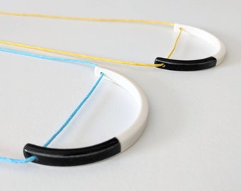 Geometric black and white porcelain necklace on turquoise or yellow cord