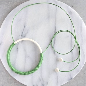 Wrapped ceramic pendant in green cotton cord - adjustable statement necklace