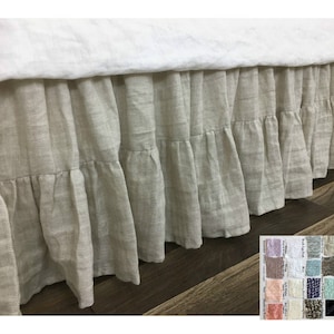 May include: A natural linen bed skirt with a ruffled edge. The skirt is a light beige color and has a simple, elegant design.