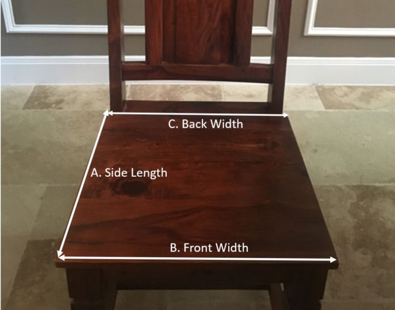 May include: A dark brown wooden chair with a rectangular seat and a slatted back. The seat has a trapezoidal shape. The chair is made of solid wood and has a rich, warm tone. The chair is designed for seating.
