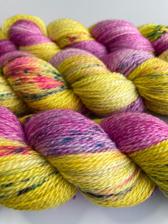 Hand dyed super wash Merino and bamboo sock weight yarn in marshmellow confetti.