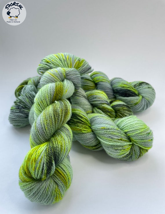 Hand dyed superwash Merino and bio nylon sock  weight yarn. ‘Madame Curie’.