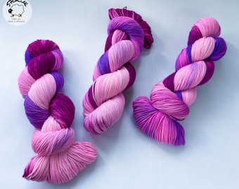 Hand dyed superwash Merino and bio nylon light fingering weight yarn. ‘Electric berries’