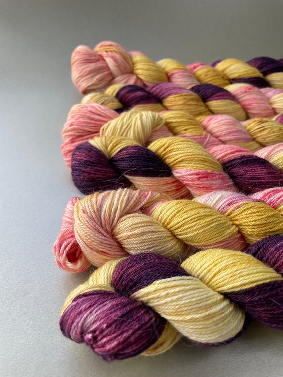 Hand dyed superwash superfine Merino, Alpaca and mulberry silk fingering weight yarn. ‘Plum harvest’
