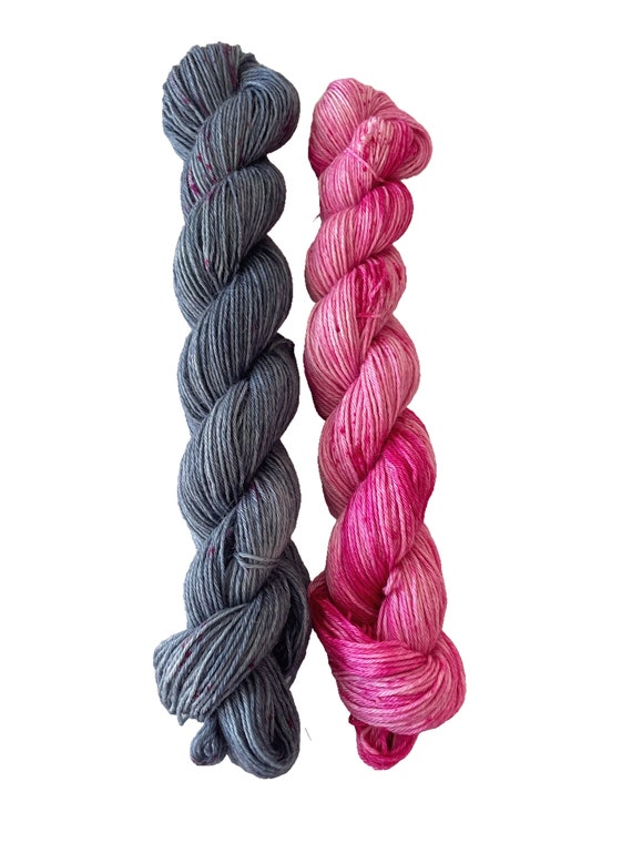 Hand dyed super wash BFL, alpaca and bio nylon sock weight duo colour set. Stone grey and raspberry pink.