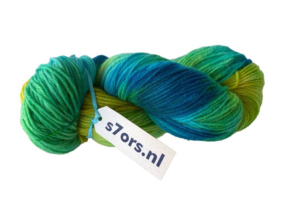 Hand dyed fine wool yarn in blue, yellow and green.