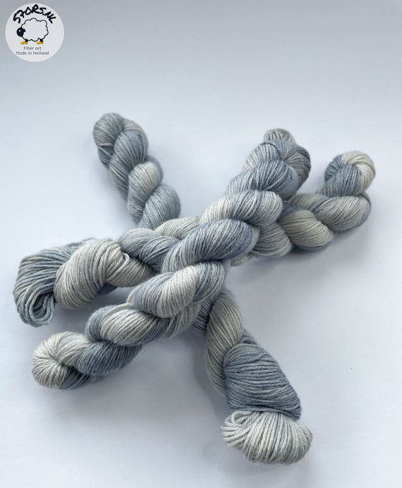 Hand dyed superwash superfine Merino, Alpaca and mulberry silk fingering weight yarn. Ombre steel grey.