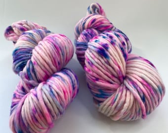 Hand dyed superwash Merino single ply bulky weight yarn. Fluorescent  speckles 'Purple rain'.