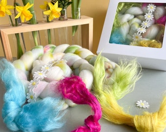 Spring themed fiber grab box. Contains over 100 grams of luxurious fibers packaged in a gift box. The ideal gift for spinners or felters.