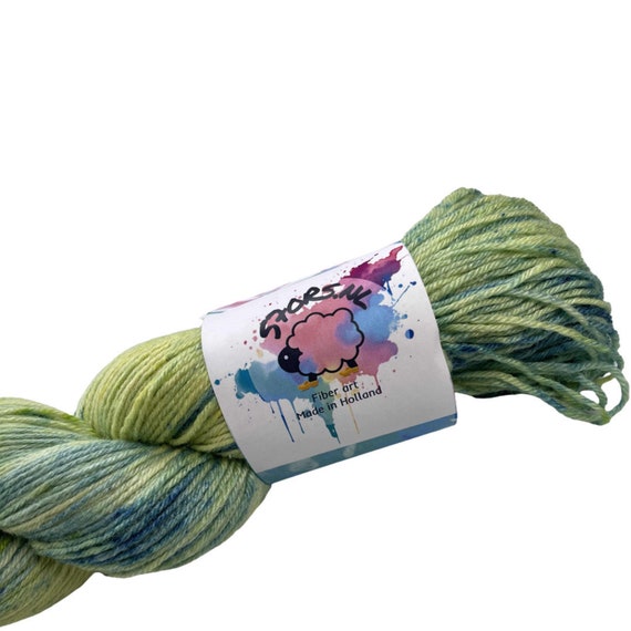 Hand dyed super wash Merino and silk sock yarn, spring green.