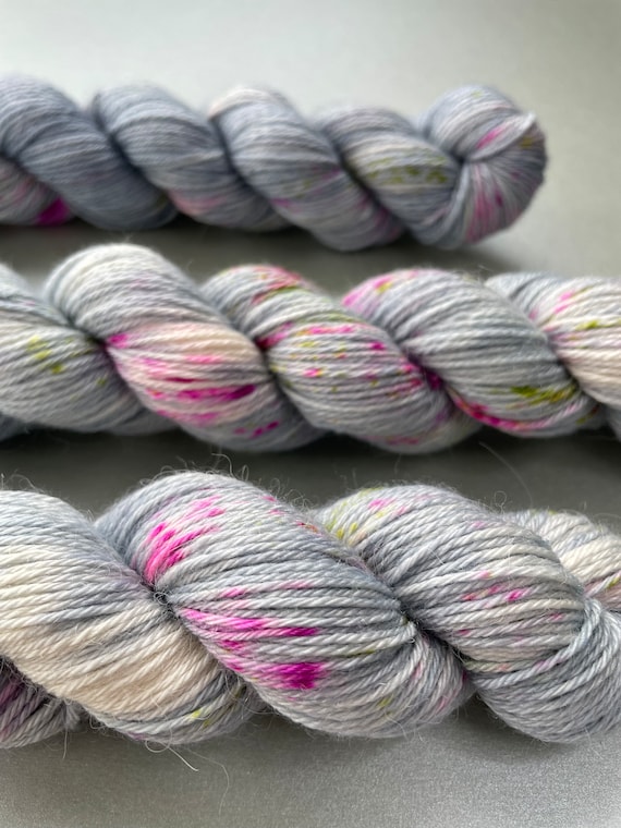 Hand dyed superwash superfine Merino, Alpaca and mulberry silk fingering weight yarn. ‘Speckled grey’