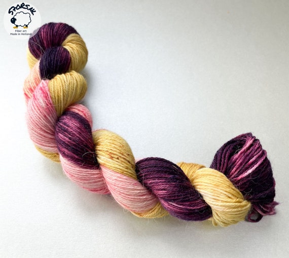 Hand dyed superwash superfine Merino, Alpaca and mulberry silk fingering weight yarn. ‘Plum harvest’