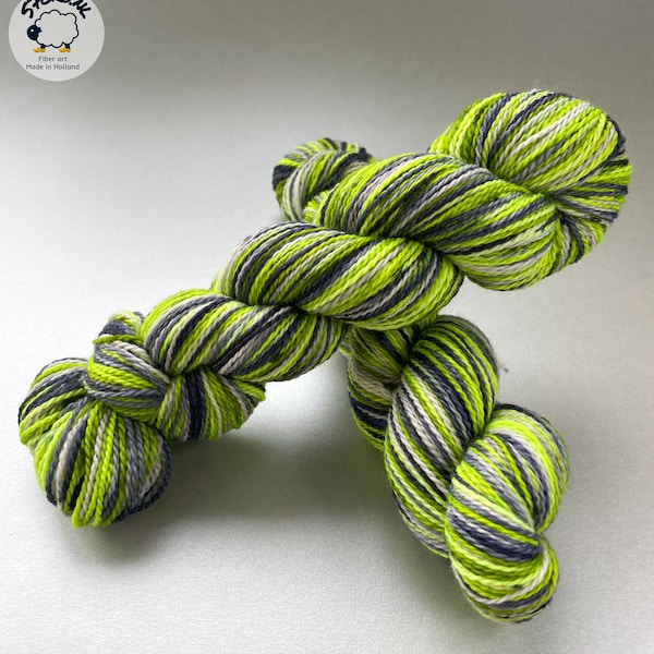 Hand dyed, self striping, superwash merino and bio nylon sock yarn. Fluorescent green, steel blue and silver grey.