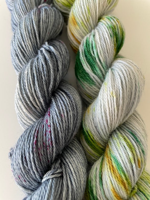 Hand dyed super wash BFL, alpaca and bio nylon sock weight duo colour set. Stone grey and speckled greens.