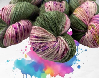 Hand dyed superwash Merino and bamboo DK weight yarn. Pooling green with fluorescent pink and purple speckles.