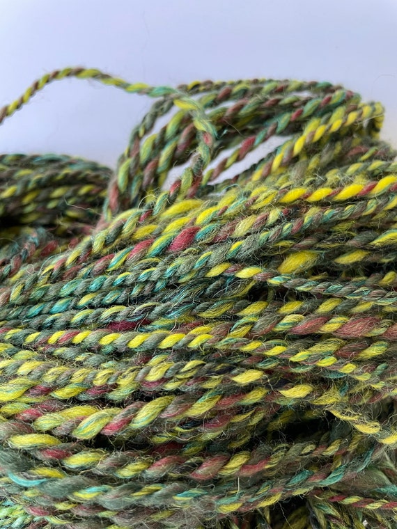 Hand spun yarn made with Shetland wool, fine merino, bio nylon and flax/linen.