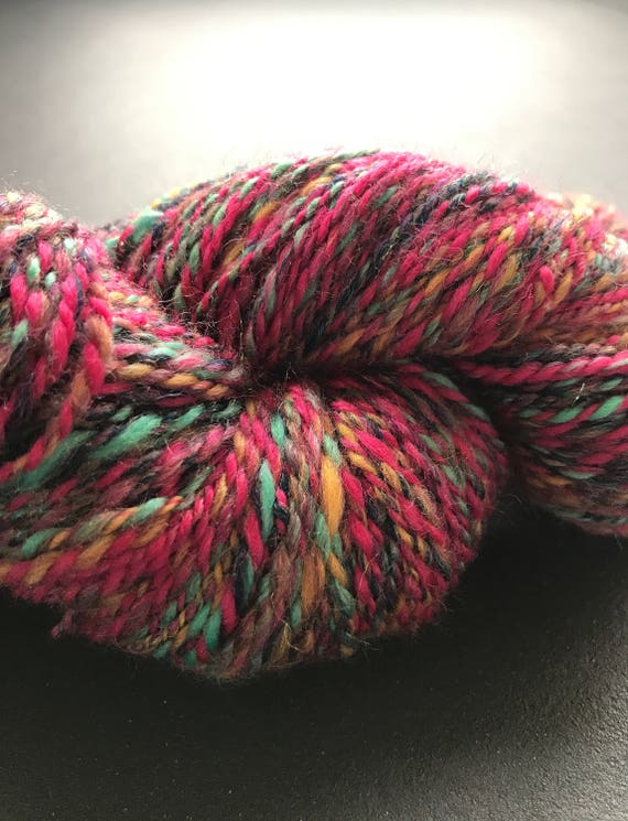 Fine hand spun sockblend yarn 'nightshift' with wool, nylon and angelina glitter fibre in red, pink, green, yellow, dark blue